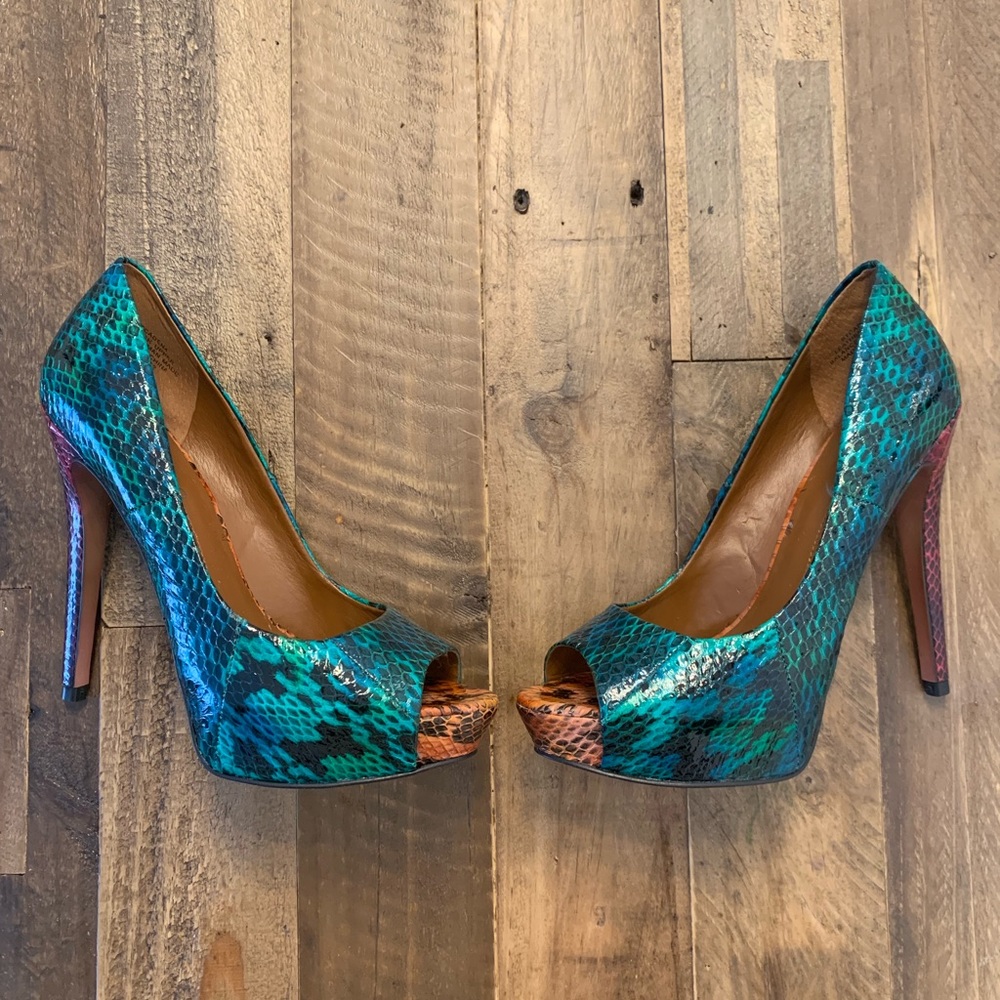 Barely used snake print platform open toe heel.
